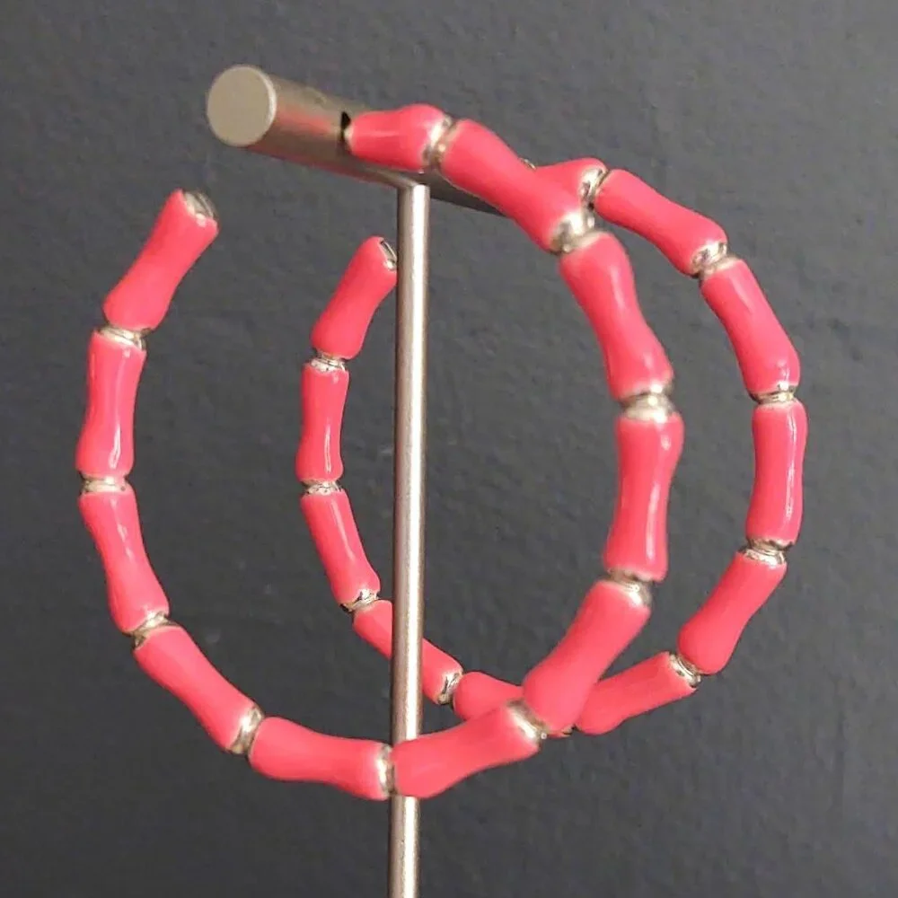 Bright glossy salmon pink enamel and silver tone hoops